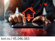 Ниспадающий график с иконкой дома и мужчиной за столом. Стоковое AI-изображение, AI-художник Александр Жуков / Фотобанк Лори
