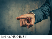 Businessman pointing finger accusingly at you. Стоковое AI-изображение, AI-художник Иван Рябоконь / Фотобанк Лори