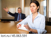 Businessman boss firing upset asian female. Стоковое фото, фотограф Яков Филимонов / Фотобанк Лори