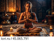 The concept of esoteric spiritual meditation, a woman in the lotus position. Human meditation, spirituality and chakra activation, mystical spirit. Стоковое AI-изображение, AI-художник Photojuli / Фотобанк Лори