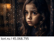 A teenage girl with a sad face alone by the window. It's raining outside the window. The concept of loneliness, depression, melancholy, resentment and bad mood. Стоковое AI-изображение, AI-художник Photojuli / Фотобанк Лори