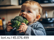 Healthy baby food. The first meal. Feeding the baby. A cute kid tastes broccoli. Fresh vegetables and fruits. Стоковое AI-изображение, AI-художник Photojuli / Фотобанк Лори