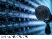 Professional condenser microphone standing in front of a recording mixer. Стоковое AI-изображение, AI-художник Иван Рябоконь / Фотобанк Лори