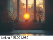 Interior of a cozy room with a large window, through which a warm autumn sunset is visible. On the windowsill there is a round lamp, the light of which imitates the setting sun, creating soft and subdued lighting in the room. Around the lamp there are indoor plants in pots, giving a lively and homely atmosphere. Warm shades of light, reflected on the floor, add a feeling of coziness and tranquility. This image is ideal for themes related to autumn mood, interior, coziness and home comfort. Стоковое AI-изображение, AI-художник Анна Кривицкая / Фотобанк Лори
