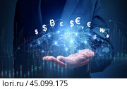 Financial Technology, internet payment, money exchange, digital banking concept. Businessman with hologram world and currency icons and bitcoin cryptocurrency on virtual screen. Стоковое фото, фотограф Павел Муравьев / Фотобанк Лори