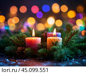 New Year candle, Christmas tree decorations, still life. Festive atmosphere of the New Year, blurred background of colored lights. Стоковое фото, фотограф Сергей Елизарьев / Фотобанк Лори