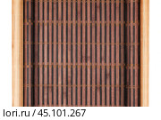 Two bamboo mat twisted in the form of manuscript isolated on white background. Стоковое фото, фотограф Александр Собко / Фотобанк Лори