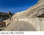 Roman Theatre in Amman, Jordan -- theatre was built the reign of Antonius Pius (138-161 CE), the large and steeply raked structure could seat about 6000 people (2014 год). Стоковое фото, фотограф Владимир Журавлев / Фотобанк Лори