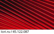 Red metallic shape gently rotating with parallel lines. Стоковое видео, видеограф Данил Руденко / Фотобанк Лори