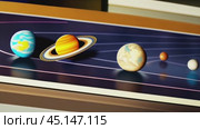 Artistic illustration of solar system showing planets and orbits in a simplified educational model. Стоковое AI-видео, аниматор Елена Старчак / Фотобанк Лори