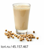 Glass of soy milk with soybeans scattered around. Стоковое AI-изображение, AI-художник Иван Рябоконь / Фотобанк Лори