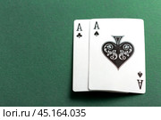 Cards and chips for poker on green table. Стоковое фото, фотограф Сергей Толмачёв / Фотобанк Лори
