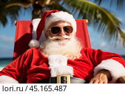 A portrait of satisfied, cheerful Santa Claus in dark glasses resting in beach lounger on a tropical beach. Стоковое AI-изображение, AI-художник Михаил Строгалев / Фотобанк Лори