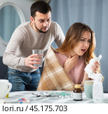 Sick woman resting at home with husband. Стоковое фото, фотограф Яков Филимонов / Фотобанк Лори