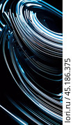 Arrangement of smooth gray lines gracefully intertwines against a soft abstract bokeh background, adding depth and allure. Composition invites the viewer to explore its fluid design. Generative AI. Стоковое AI-изображение, AI-художник Юлия Петровская / Фотобанк Лори
