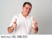 An older man smiling and reaching out with both hands. Стоковое фото, фотограф Сергей Толмачёв / Фотобанк Лори