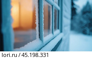 Frosty windowpane with warm glow inside contrasts the cold, snowy exterior, AI. Стоковое AI-изображение, AI-художник Сергей Старуш / Фотобанк Лори