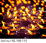 Burning candles in Buddhist temple, McLeod Ganj. Стоковое фото, фотограф Дмитрий Рухленко / Фотобанк Лори