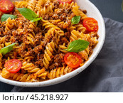Bolognese pasta. Fusilli with tomato sauce, ground minced beef. Стоковое фото, фотограф Natalia Gdovskaia / Фотобанк Лори