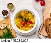 Healthy bright spring vegetable dietary vegetarian soup with broccoli, top view, close up. Стоковое фото, фотограф Natalia Gdovskaia / Фотобанк Лори