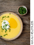 Polenta, porridge with Parmesan cheese and poached egg, Стоковое фото, фотограф Natalia Gdovskaia / Фотобанк Лори