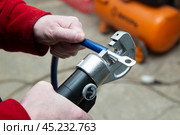 Crimper for crimping wires.A professional tool for compressing large diameter wires. Стоковое фото, фотограф Александр Поташев / Фотобанк Лори