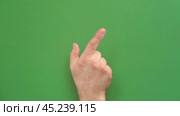 Gestures pack. Male hand touching, clicking, tapping and swiping on chromakey green screen. Zoom in, zoom out. Close up. 4K Footage Pack. Using for a smartphone, tablet pc or a touch screen devices. Стоковое видео, видеограф Марина Демидюк / Фотобанк Лори