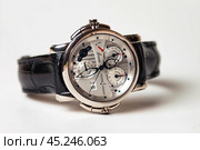 Munich, Swiss - 24 oct 2024: swiss wrist watch Ulysse Nardin SONATA Cathedral, close-up 3d. Silver wristband and bright steel dial, tachymeter, chronograph. Luxury watches concept. Copy ad text space. Редакционное фото, фотограф Aleksandr Golubev / Фотобанк Лори