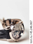 Munich, Swiss - 24 oct 2024: swiss wrist watch Ulysse Nardin SONATA Cathedral, close-up 3d. Silver wristband and bright steel dial, tachymeter, chronograph. Luxury watches concept. Copy ad text space. Редакционное фото, фотограф Aleksandr Golubev / Фотобанк Лори