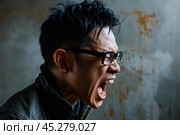 Expression of furious,enraged asian man with grumpy grimace on his face,with mouth opened in shout, ready to argue and swear, wants to gain respect, Angry asian man yelling on grey dirty background. Стоковое AI-изображение, AI-художник Sergey Grishin / Фотобанк Лори