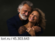 Portrait of beautiful couple, man and woman of respectable age. Стоковое AI-изображение, AI-художник Klimiankova Tatsiana / Фотобанк Лори