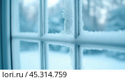 Frosty windowpane with intricate ice patterns on a cold winter morning, AI. Стоковое AI-изображение, AI-художник Сергей Старуш / Фотобанк Лори