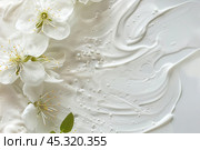 White cream texture and flowers. Body lotion swipe swatch. Skincare mask. Cosmetic face serum smudge. Moisturizer smooth smear. Trendy bio selfcare beauty product. Peptides, ceramides, retinol. CC, BB. Стоковое AI-изображение, AI-художник Евгений Демидюк / Фотобанк Лори