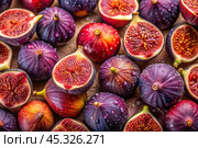 There are a lot of figs with a delicate purple skin and in the cut. A frame showing the natural texture and color. Close-up of fruits. Стоковое AI-изображение, AI-художник Photojuli / Фотобанк Лори