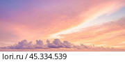 Sunset cloudscape Panoramic with rich purple and pink tones blending into orange at horizon, tranquil evening sky view, natural dusk setting, soft wispy cloud formation, twilight backdrop. Стоковое фото, фотограф Павел Муравьев / Фотобанк Лори