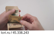 The Hands Counting Money with a Strong Focus on Cash Notes as Valuable Assets in Finance. Стоковое видео, видеограф Громов Александр / Фотобанк Лори