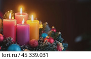Burning advent candles creating festive atmosphere for christmas celebration. Стоковое AI-видео, аниматор Юрий Поздников / Фотобанк Лори