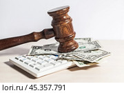 judge gavel and money on brown wooden table concept. Стоковое фото, фотограф Сергей Толмачёв / Фотобанк Лори