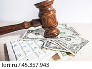 judge gavel and money on brown wooden table concept. Стоковое фото, фотограф Сергей Толмачёв / Фотобанк Лори