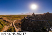 Aerial view of Armenian Khor Virap Monastery against Ararat Mount on sunny summer evning. Ancient church most popular touristic destinations during sunset. Dramatic landscape. Armenia, Europe. Стоковое фото, фотограф Алексей Ширманов / Фотобанк Лори