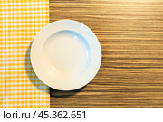 the plate on yellow checkered table cloth. Стоковое фото, фотограф Сергей Толмачёв / Фотобанк Лори