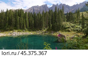 Lake landscape with mountain and forest, Lago di Carezza, Dolomites, Italy. Стоковое видео, видеограф Яков Филимонов / Фотобанк Лори