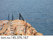 Baikal Lake. Olkhon Island. In nature reserve on Cape Sagan-Khushun or Three Brothers, installation of suspension bridges began in summer 2024. Local residents protest, prosecutor office began investigation. Редакционное фото, фотограф Виктория Катьянова / Фотобанк Лори