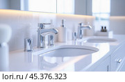 Modern bathroom faucets with oval sinks creating a luxurious ambiance. Стоковое AI-изображение, AI-художник Юрий Поздников / Фотобанк Лори