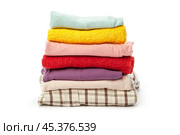 stack of clothing isolated on white. Стоковое фото, фотограф Сергей Толмачёв / Фотобанк Лори