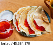 Pancakes with red caviar served on platter. Стоковое фото, фотограф Яков Филимонов / Фотобанк Лори