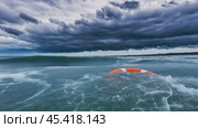 Lifebuoy floating on stormy sea with dark clouds representing hope and survival. Стоковое AI-видео, аниматор Юрий Поздников / Фотобанк Лори