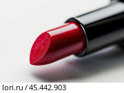 Red lipstick showing moisturized lip makeup product. Стоковое AI-изображение, AI-художник Иван Рябоконь / Фотобанк Лори
