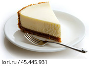 Delicious Slice of Creamy Cheesecake Delightfully Presented on a Plate. Sweet dessert. Close-up. Indulge in a tempting slice of rich cheesecake, featuring a delightful and crumbly graham cracker crust. Стоковое AI-изображение, AI-художник Марина Демидюк / Фотобанк Лори