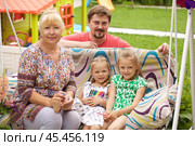 Grandmother, young father and two daughters. Стоковое фото, фотограф Андрей Аркуша / Фотобанк Лори